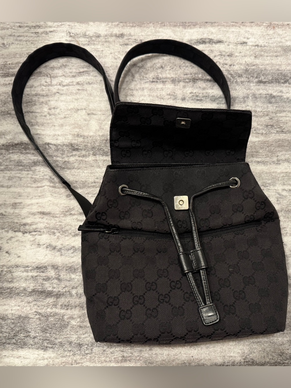 Authentic, Vintage Gucci Black Monogram Drawstring Backpack with Front Zip